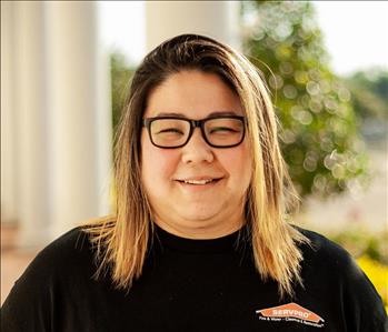 Woman with short hair and glasses 