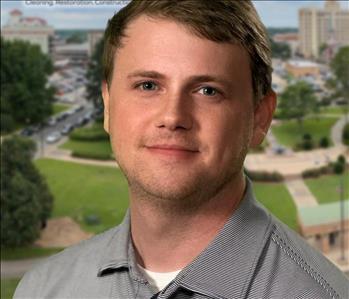 Man in front of Monroe Skyline