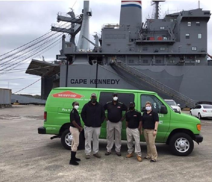 SERVPRO team members and vehicle in front of MV Cape Kennedy