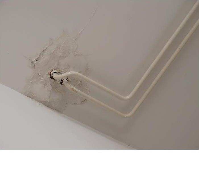 ceiling water damage from exposed pipes