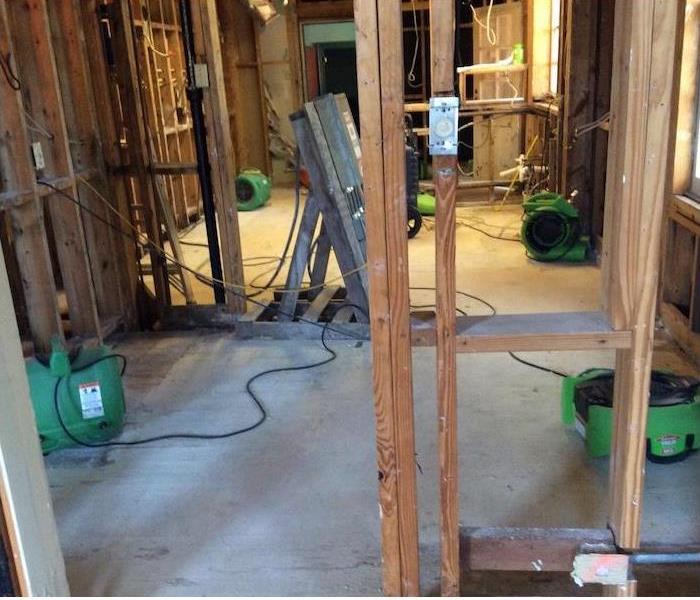 SERVPRO equipment in a water damaged home demolished to the studs