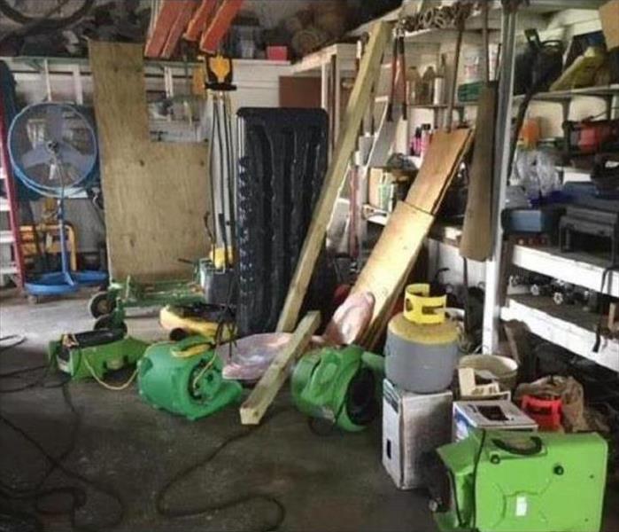 SERVPRO equipment in a garage of a house