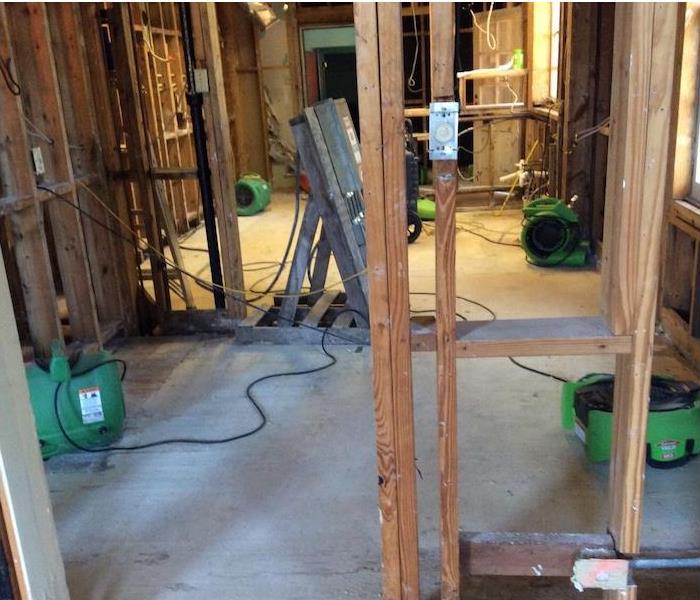 SERVPRO equipment in a water damaged home demolished to the studs