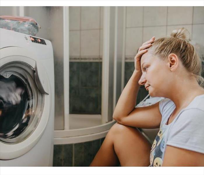 Woman with washing machine