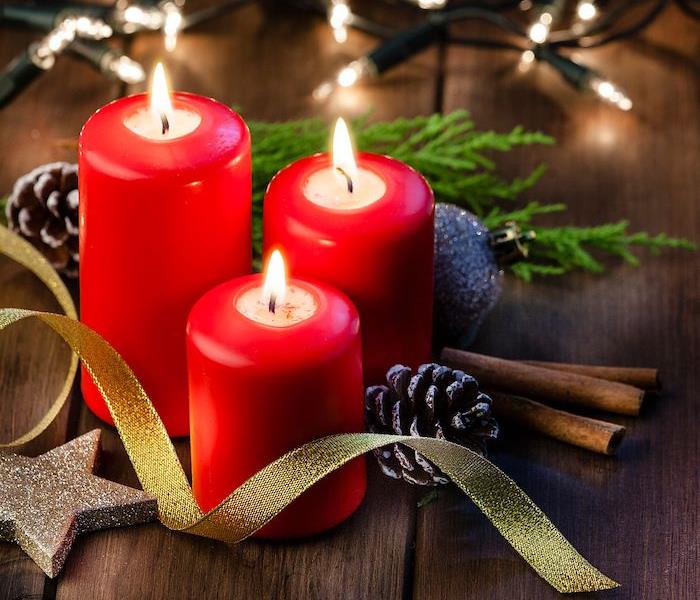 Red candles with Christmas decor